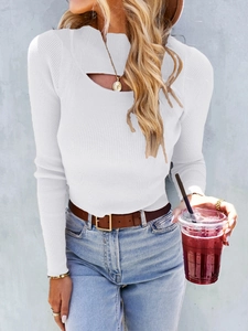 Close-up of white ribbed knit sweater featuring a stylish oval cut-out at the neckline