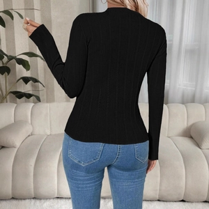 Detailed view of the back of a slim fit black ribbed knit sweater for women