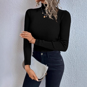 Detail of black turtleneck knit sweater featuring vertical ribbed texture and slim fit design