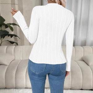 Close-up of white slim fit long sleeve knit top with vertical ribbed texture for women