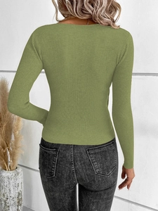 Detail view of the olive green ribbed knit top featuring a slim fit and textured fabric