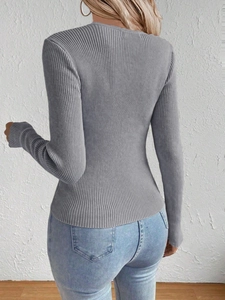 Close-up back view of a grey slim fit ribbed knit sweater showing fine fabric texture