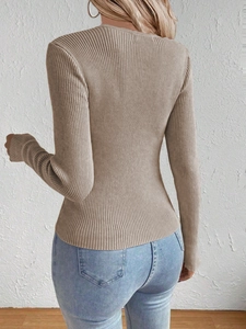 Rear view of a slim fit beige ribbed knit sweater with a classic crew neck design