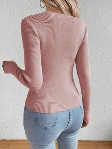 Rear view of slim fit dusty pink ribbed knit sweater with long sleeves and round neck