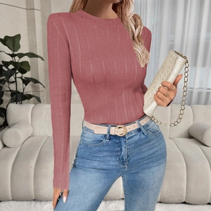 Detailed view of the dusty pink ribbed knit texture and slim fit design on a female model