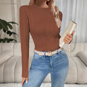 Detail of red brown ribbed knit sweater with slim fit cut and elegant round neckline
