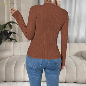 Macro shot of the brown ribbed knit fabric texture and slim fit design on the sweater back