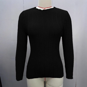 Close-up of black ribbed knit sweater with crew neck and slim fit long sleeves