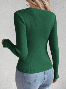 Rear view of a slim fit dark green rib-knit sweater showing the fabric texture and cut