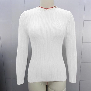 Detail of white ribbed knit fabric on a slim fit long sleeve sweater for women