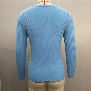 Detailed back view of a sky blue long sleeve slim fit knit sweater with ribbed texture