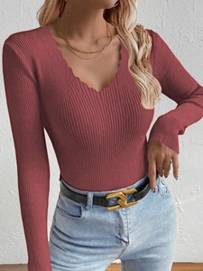 Close-up of dark red slim fit V-neck knit sweater with scalloped edge detail