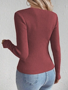 Back view of burgundy slim-fit ribbed knit sweater showing the sleeve length and texture