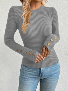 Detail showing the vertical ribbed knit texture and golden buttons on grey sweater sleeves