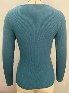 Detailed view of the back of a peacock blue rib-knit slim fit long sleeve sweater