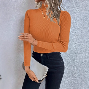 Detail of orange high neck slim fit ribbed knit sweater showing fabric texture