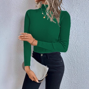 Detailed view of the dark green ribbed texture on a slim-fit turtleneck knit sweater