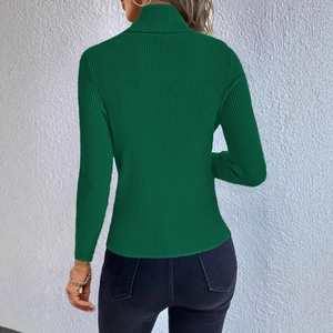 Detail view of the deep green high neck ribbed knit sweater featuring slim fit texture