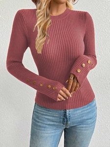 Detail showing gold button embellishments on the ribbed knit cuffs of this slim top