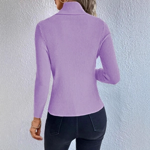 Close-up of lavender ribbed knit turtleneck sweater showing texture and slim fit