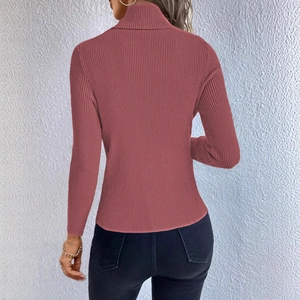 Detailed back view of dusty pink turtleneck sweater with vertical ribbed knit texture