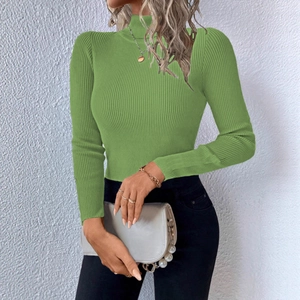 Detail of green turtleneck ribbed knit sweater for women with long sleeves and slim fit design