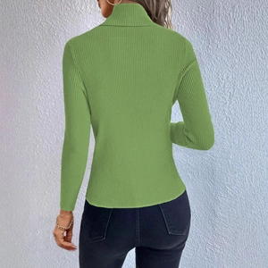 Rear view of a grass green ribbed knit turtleneck sweater with a slim fit design