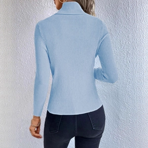 Detailed back view of a slim fit light blue ribbed knit turtleneck sweater for women