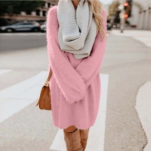 Pink plush knit mini dress for autumn/winter shown in an outdoor street style