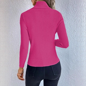 Rear view of fuchsia ribbed knit sweater showing the slim fit and turtleneck detail