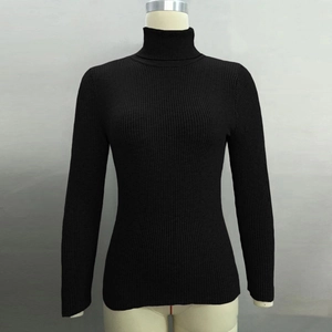 Close-up of black ribbed knit turtleneck sweater featuring high collar and slim-fit texture