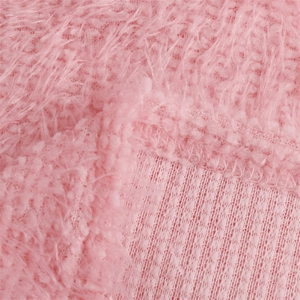 Detail shot of soft pink long-pile faux fur fabric with premium stitching and mesh lining