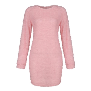 Close-up of pink fuzzy knit fabric on a slim fit long sleeve dress with soft plush texture