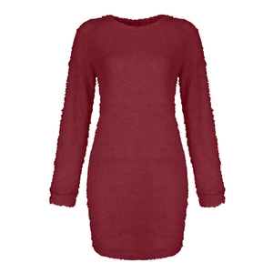 Detailed view of the fuzzy burgundy fabric and plush knit texture on a long sleeve dress