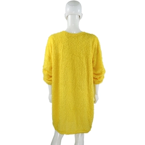 Detail of loose yellow fuzzy knit sweater dress showing fluffy texture and crew neck back