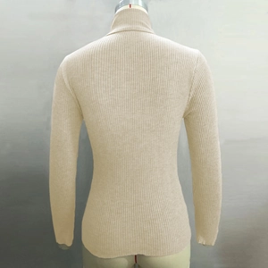 Detail view of the ribbed knit texture and slim fit design on back of a beige turtleneck sweater