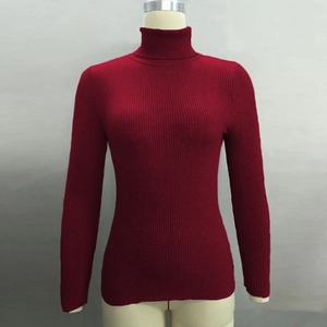 Detail of the high turtleneck and ribbed knit texture on a red long sleeve sweater
