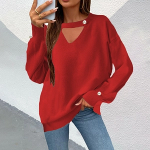 Detail of red V-neck knit sweater featuring a choker cutout and elegant pearl buttons