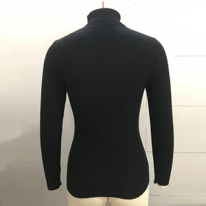 Detail of black long sleeve turtleneck ribbed knit sweater back view on a mannequin