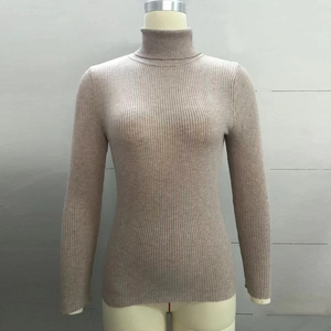 Close-up of oatmeal high-neck knit sweater featuring elastic ribbed texture and slim-fit design