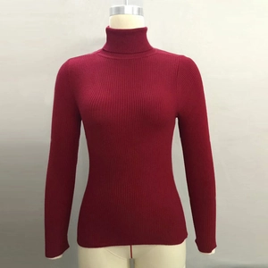 Detailed view of the burgundy ribbed knit turtleneck sweater on a mannequin