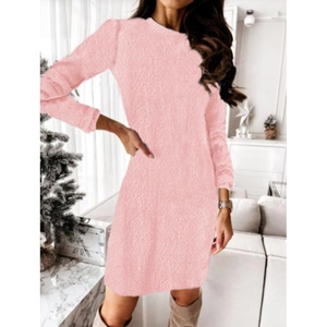 Women's pink long sleeve plush knit sweater dress in a cozy home setting