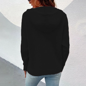 Detail of black hooded ribbed knit cardigan with drawstring and drop shoulder design