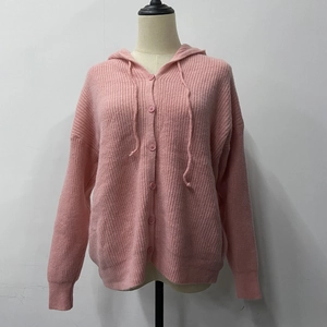 Detail view of pink hooded knit cardigan with matching buttons and drawstring texture