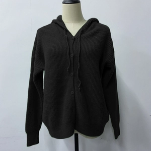 Close-up of ribbed knit hooded cardigan with front buttons and drawstring detail