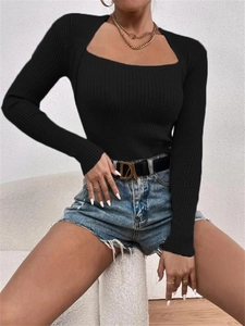 Close-up of black ribbed knit texture and square neckline on slim-fit long sleeve top