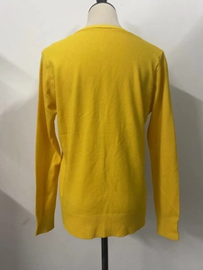 Back view of yellow long sleeve knit cardigan with classic ribbed hem and cuffs