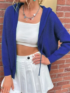 Detail of royal blue hooded knit cardigan featuring button closure and textured fabric