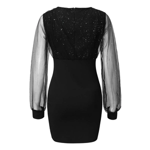 Detailed back view of a slim-fit black mini dress with mesh sequin sleeves and a zipper