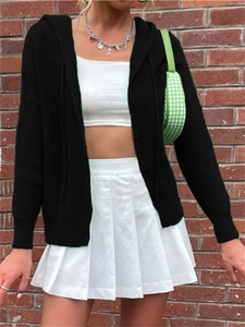 Detail of a black hooded knit cardigan with ribbed texture and classic button closure